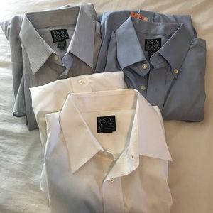 Three dress shirts, blue, white, and striped